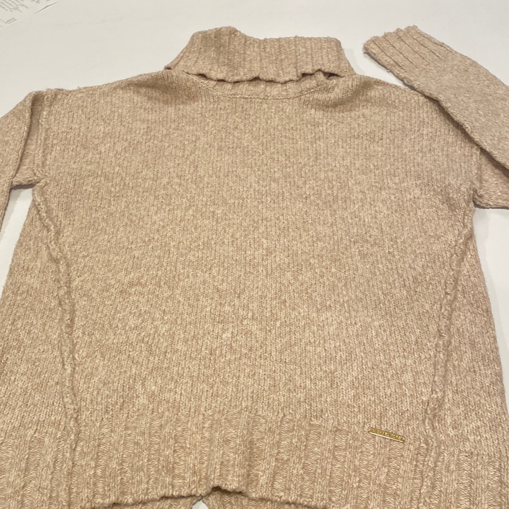 Michael Kors cowl necked sweater in a heather look with shades of oatmeal.